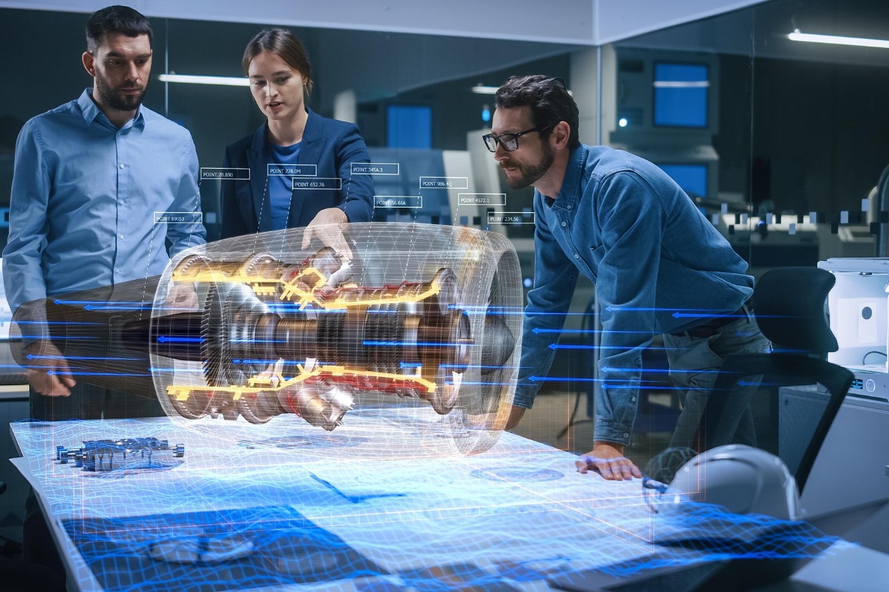  Meeting room in the aviation factory: A team of three people works on an augmented reality aircraft engine simulation. © Gorodenkoff / stock.adobe.com